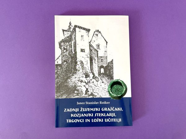 Knjiga z naslovom "Zadnji žusemski graščaki, kozjanski steklarji, trgovci in loški učitelji" s črno-belo skico gradu na naslovnici, prikazano na vijolični podlagi z zelenim voščenim pečatom.